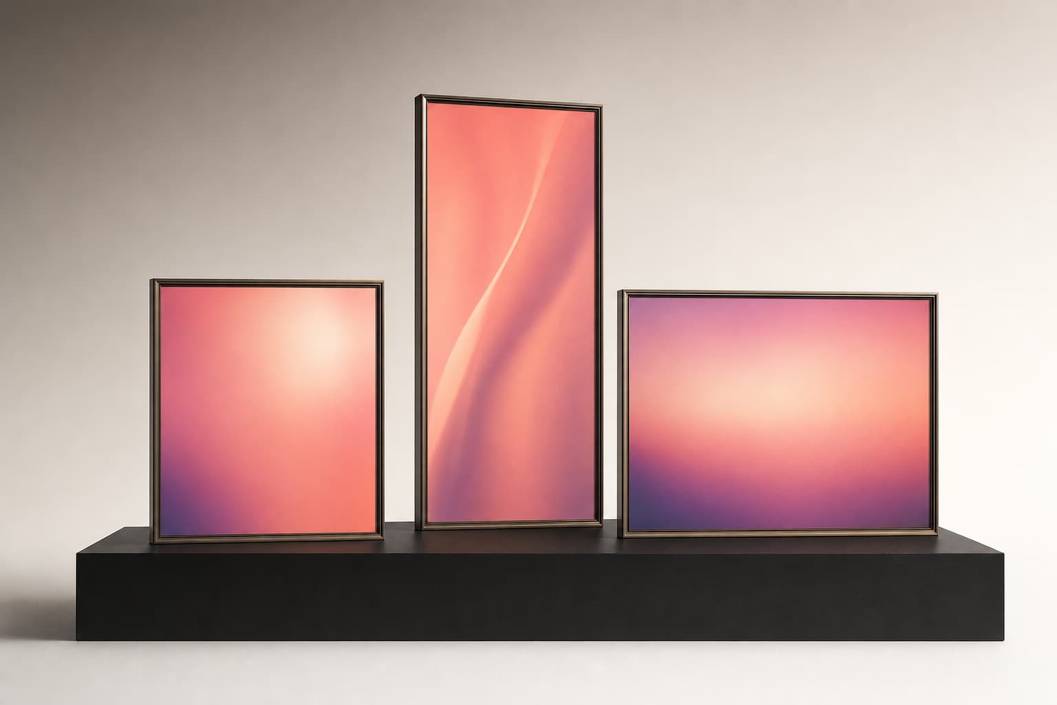 Square, portrait, and wide gradient frames displayed on a black plinth